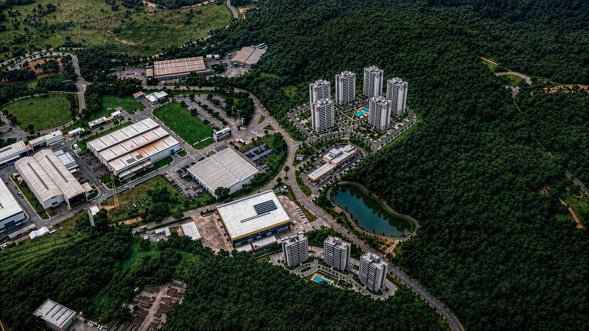Render aéreo do masterplan completo com torres residenciais, street mall e galpões